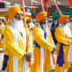 The Panj Pyare - The five beloveds carrying the Sikh flags called Nishan Sahib.