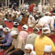Langar (community food) being served and people sitting in a pangat (on the floor, in rows). The head is always covered when in the Gurudwara premises as a mark of respect to the Lord.