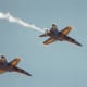 Two Blue Angles F/A-18s in flight.
