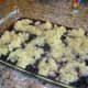I used about 2 cups of frozen blueberries, thawed in the refrigerator overnight. Dump those in the cake pan then dump the can of crushed pineapple over the top, distributing evenly.