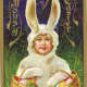 Little kid in Easter bunny costume carrying Easter baskets vintage card