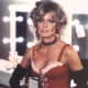 Farrah Fawcett posing in a dressing room