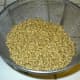 When all the wheat is clean, we put it in a colander to rinse it until it's very clean.