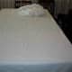 Next, arrange a large white cotton sheet over the towels. Do not use flannel. Smooth the sheet out as best you can. As you can see, I didn't iron it, but one could.