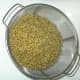 Put the cooked wheat into the colander again. Rinse it until any scum or residue is gone.