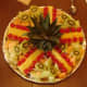 Lay out the pineapple top and the prepared pieces around it.