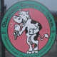 funny cow eating ice cream in pink and green clip art fashion on store front in Lake Geneva Wisconsin