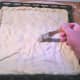 Brush the top with the lard.