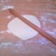 On a floured surface, roll the first into a circle approx. 20Cm diameter.