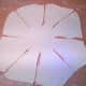 Leave in the middle a circle 15 cm in diameter, and from it to the ends radially cut the dough into 8 pieces as shown in the picture.