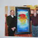 My Wife and I Standing Next to Peter Max and One of His Paintings That We Didn't Buy. It was $ 60,000 for goodness sakes. (He brings his own photographer, by the way.)