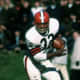 Cleveland Hall of Fame running back Jim Brown (32) gets past New York Giants safety Henry Carr during a 34-21 Browns victory on Nobemver 14, 1965, at Cleveland Municipal Stadium in Cleveland, Ohio. (Photo by Tony Tomsic/NFL)