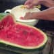 Scoop out the watermelon and place in a separate container.