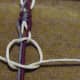 12.  Make a left half knot and pull gently to meet right half knot to create a square knot.