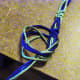 11. Make an overhand knot gently pulling until it meets the last two square knots. Pull tightly.