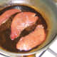 Lambs liver is first to be added to the frying pan