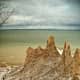 Chimney Bluffs State Park is located on Lake Ontario and has spectacular spires created by glaciers.