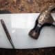 Using punch and hammer to make small indentations, to prevent the drill bit slipping.