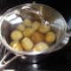 Boiling the potatoes, once they've been washed and any green skin has been removed; otherwise I tend to cook the potatoes with the skins on for a little extra healthy roughage in the diet.