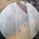 Wooden circle disc cut from pine wood floorboard