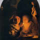 Lovers lit by a candle