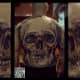 Skull back tattoo on male