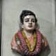 A bust of Swami in the temple.