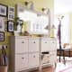 By cutting off the back legs of a cabinet, you can bring it flush to the wall. Drop drawers from 2 cabinets joined together by one countertop.