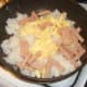 Spam and egg is added to frying rice