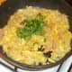 Freshly chopped coriander is stirred through fried rice