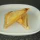 Trimmed and sliced cheese and Spam toastie is plated