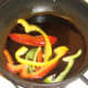 Briefly frying bell pepper slices
