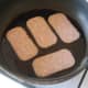 Shallow frying Spam slices