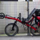 A Recumbent two wheel bicycle with saddle bags.