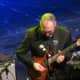 Guitarist Chuck Loeb, get down during his performance at the jazz fest. 