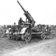 In the First World War British troops with a German 88mm Flak gun originally designed by Krupp as an anti-balloon gun.