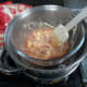 Giving it a quick stir to mix the jam into the white chocolate