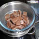 The milk chocolate for the truffles outer coating being melted in the steamer