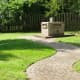 Paved path to the Tri-County Marker in Thomas Park