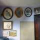 Pictures and painting rehung around the office door and notice board