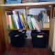 The waste bins slid underneath the new shelving. General waste on the left, and confidential waste on the right