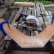 Cutting the back corners off the two lower shelf pieces. The top shelf to be kept intact