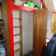 View showing the relocated clothes rail, turned around by 90 degrees; creating a mini-walk in wardrobe