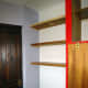 The pine table top cut to size for shelving, and fitted in place