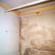 Plaster repair done on the brick wall