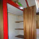 The large shelving around the corner, behind the clothes rail, to be removed as it was not very accessible