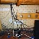 The cable management trough screwed to the wall, and a new 4-gang power surge socket also wall mounted under the desk