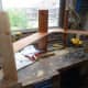 Gluing the supports to the middle shelf at the joints