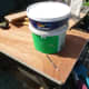 Using a large paint pot to mark out the curve for the inner corner of the unit