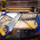 Cutting the housing joint in the end supports, and making sure the middle shelf is correspondingly longer than the top and bottom shelves; for a perfect fit